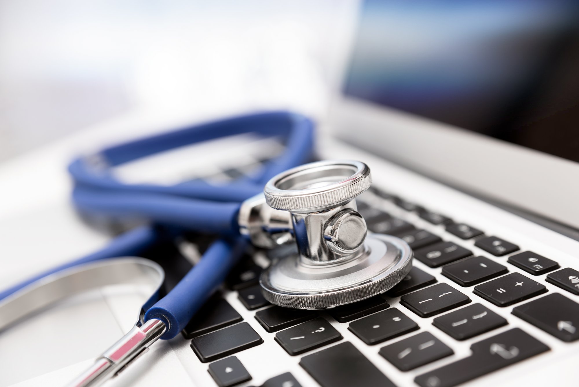 Stethoscope on laptop keyboard Stethoscope on laptop keyboard